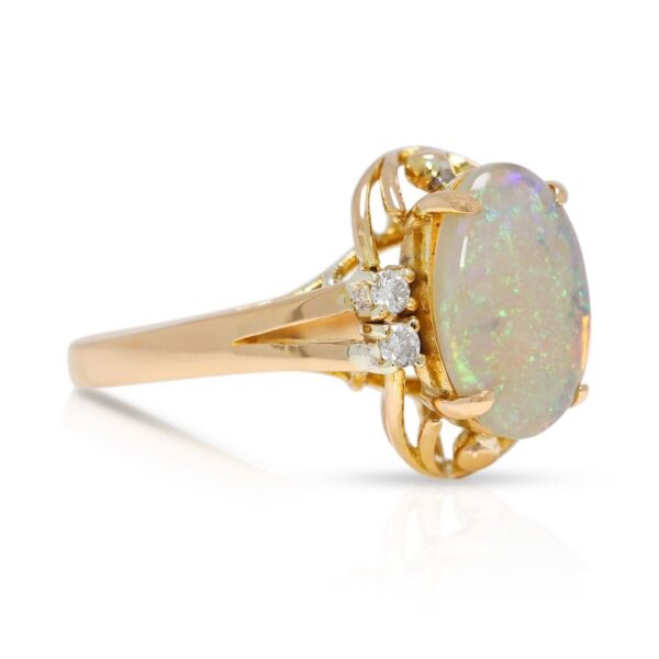 טבעת אופל כחול שובה לב ויהלום טבעי 0.06 קראט בזהב צהוב 20K