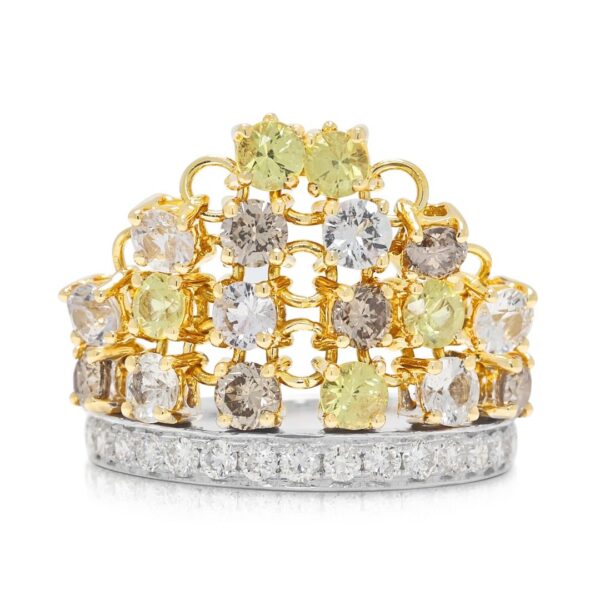 טבעת וינטג' מפוארת בשיבוץ תעלה, עם ספיר ויהלומים במשקל 1.03 קרט, בזהב דו-גוני 18 קראט.